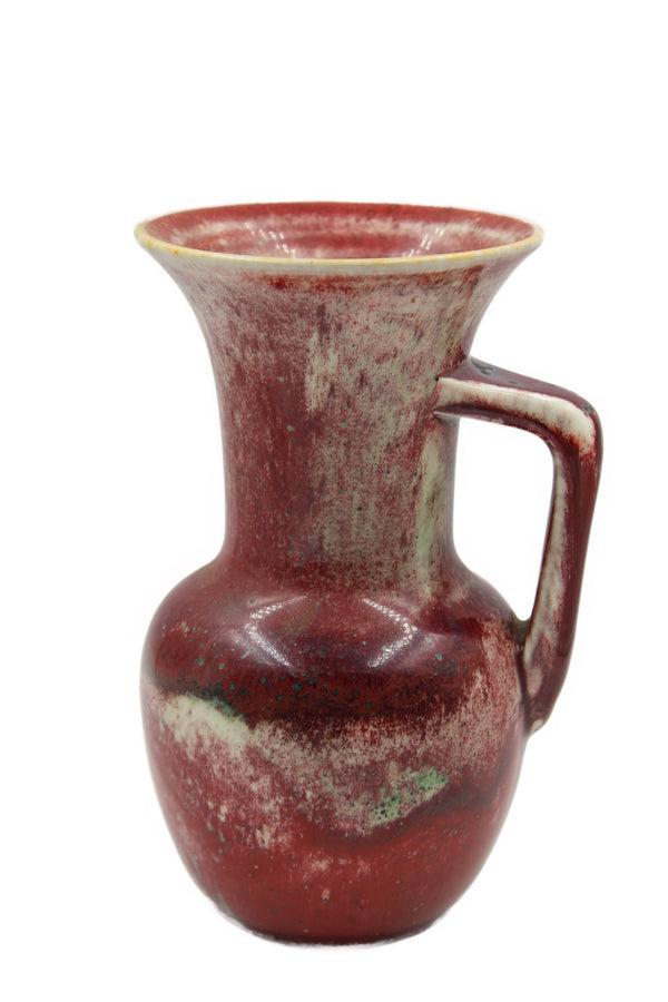 A Ruskin single-handed vase decorated with a high fired sang-de-bœuf glaze